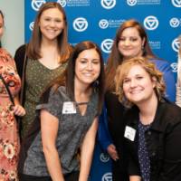 six women pose for close up picture